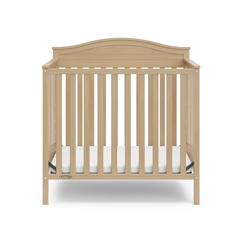 Graco Stella 4-in-1 Convertible Mini Crib with Bonus Mattress (Driftwood) – Includes Bonus 2.50 Inch Thick Mattress with Water-Resistant Cover