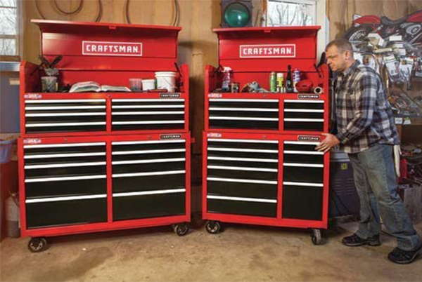 Tool cabinet with drawer lining roll and sleeve organizer