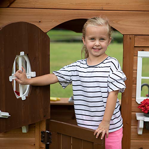 Backyard Discovery Aspen Cedar Wooden Kids Playhouse Cottage with Play Kitchen, Snack Bar, Picnic Bench, Dinner Bell, Mailbox, Dutch Door