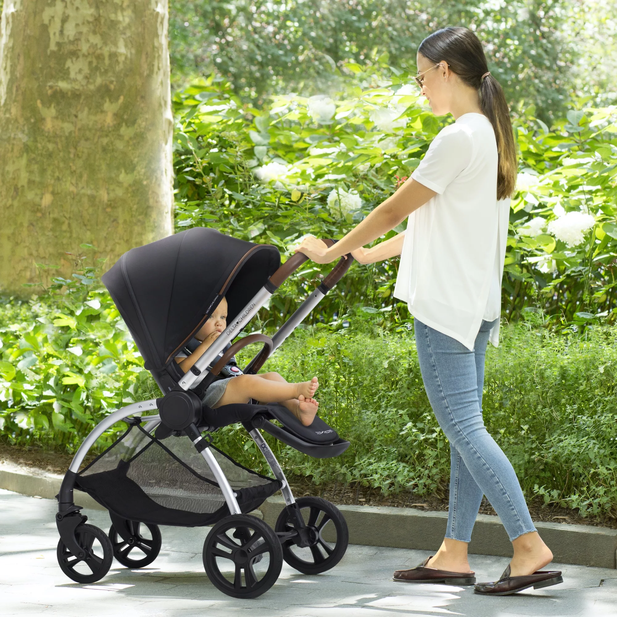 Delta Children Revolve Reversible Stroller - Leather Handlebar; One Hand Easy Fold; Lightweight Shock-Absorbing Frame