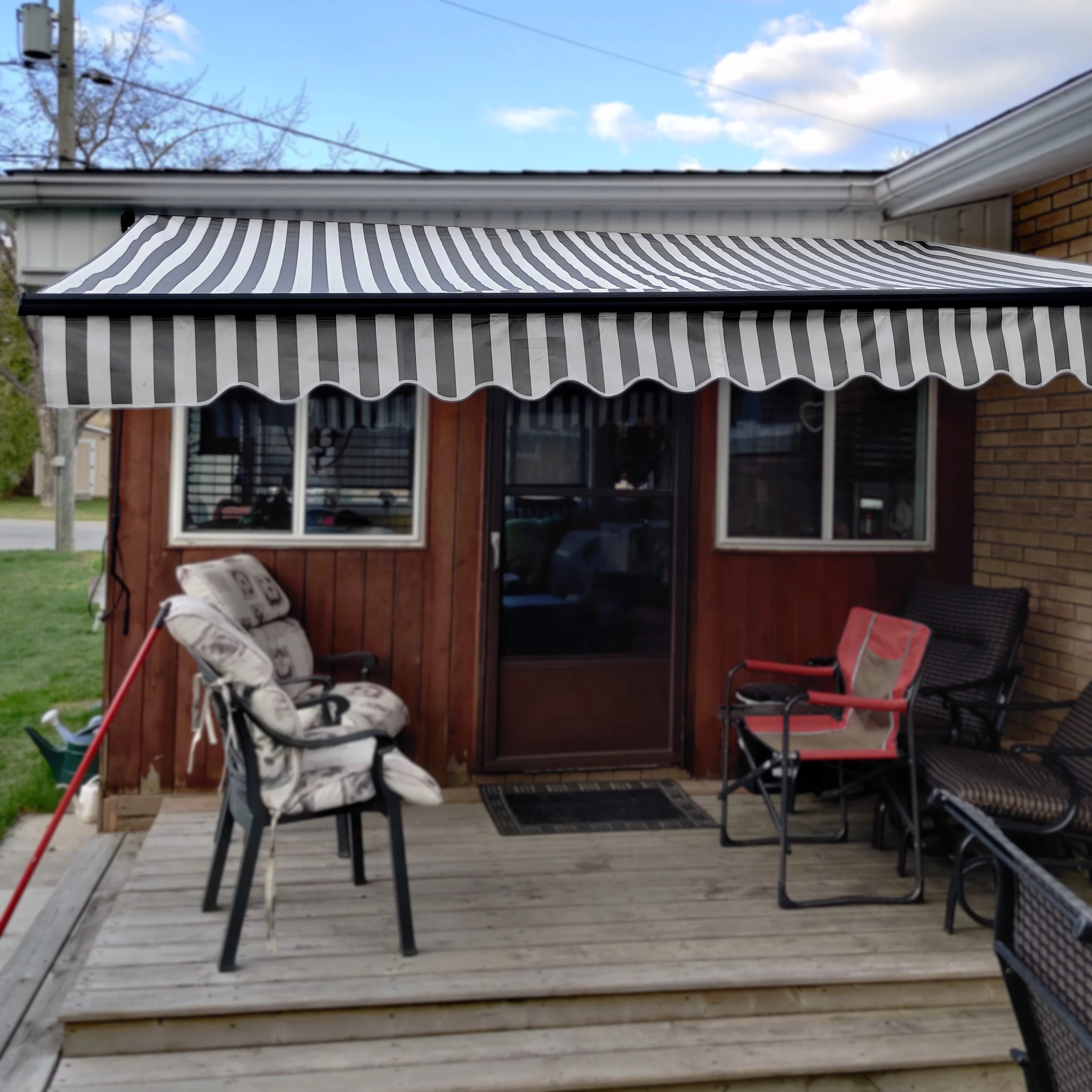 ALEKO 20' x 10' Retractable Motorized Black Frame Patio Awning, Gray and White Striped Color