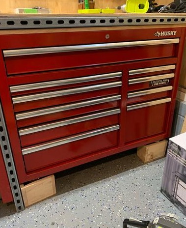 HuskyTool 46 in. W x 24.5 in. D 9-Drawer Gloss Black Deep Tool Chest Mobile Workbench with Hardwood Top and Power Station, Red, (H46MWC9V2PWR)