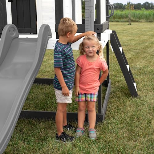 Backyard Discovery Beacon Heights Elevated Cedar Playhouse, Play kitchen, Powered Blender, Working Bell, 6 ft Wave Slide, Wrap-Around Deck