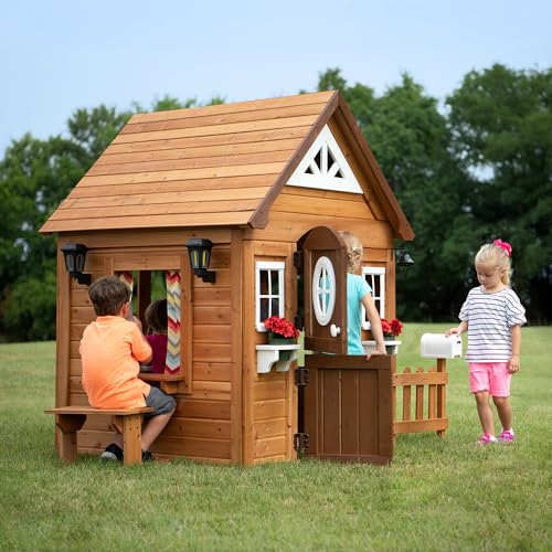 Backyard Discovery Aspen Cedar Wooden Kids Playhouse Cottage with Play Kitchen, Snack Bar, Picnic Bench, Dinner Bell, Mailbox, Dutch Door