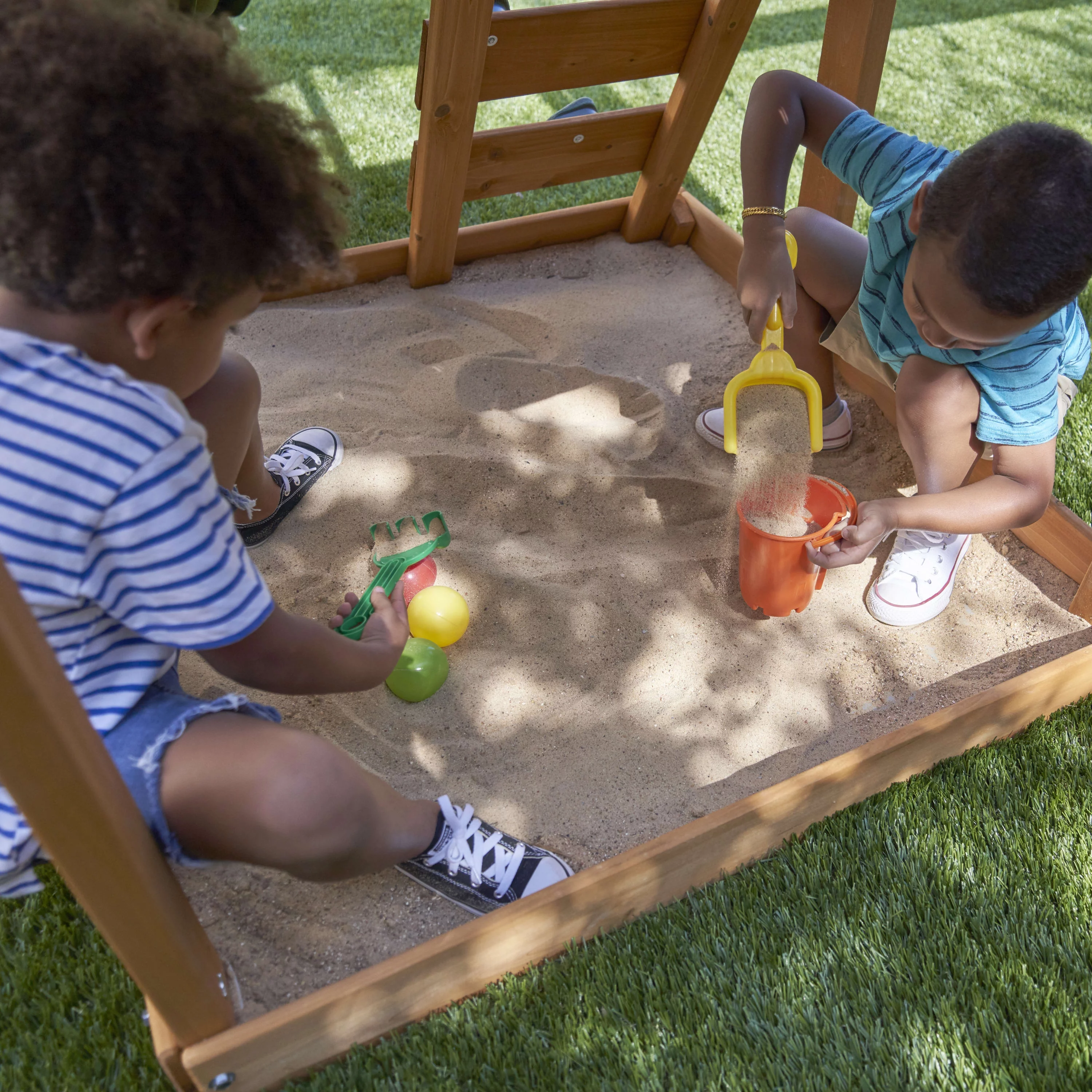 KidKraft Ainsley Wooden Outdoor Swing Set with Slide and Rock Wall - Radiant Selections