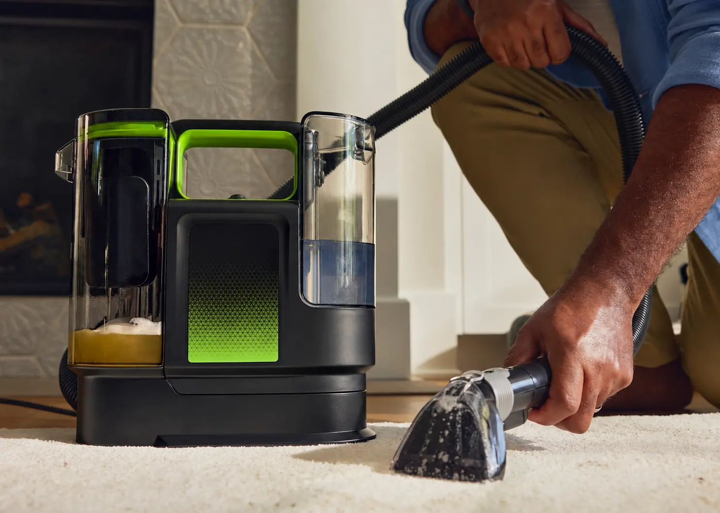 Unbranded portable spot cleaner removing a carpet stain