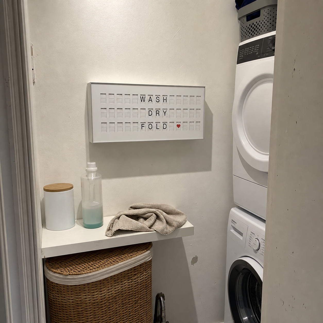 Customer photo of a white 45 Bits display in a compact apartment laundry nook
