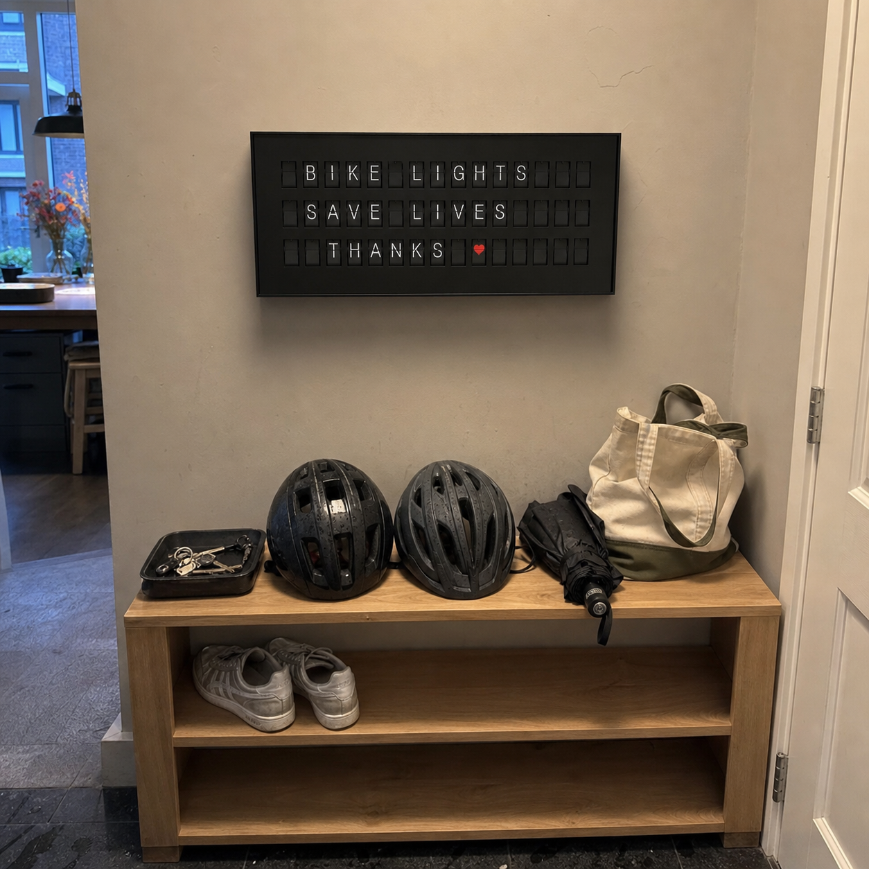 Customer photo of a black 45 Bits display above a practical cycling entry bench