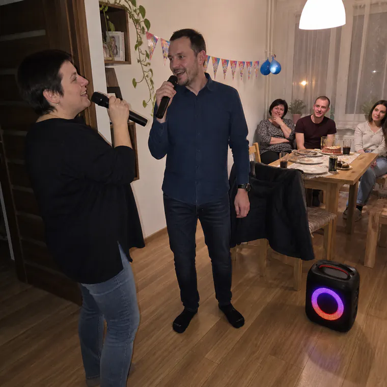 Family using both microphones at a Krakow birthday