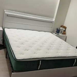 Mattress styled in bedroom with headboard and nightstands