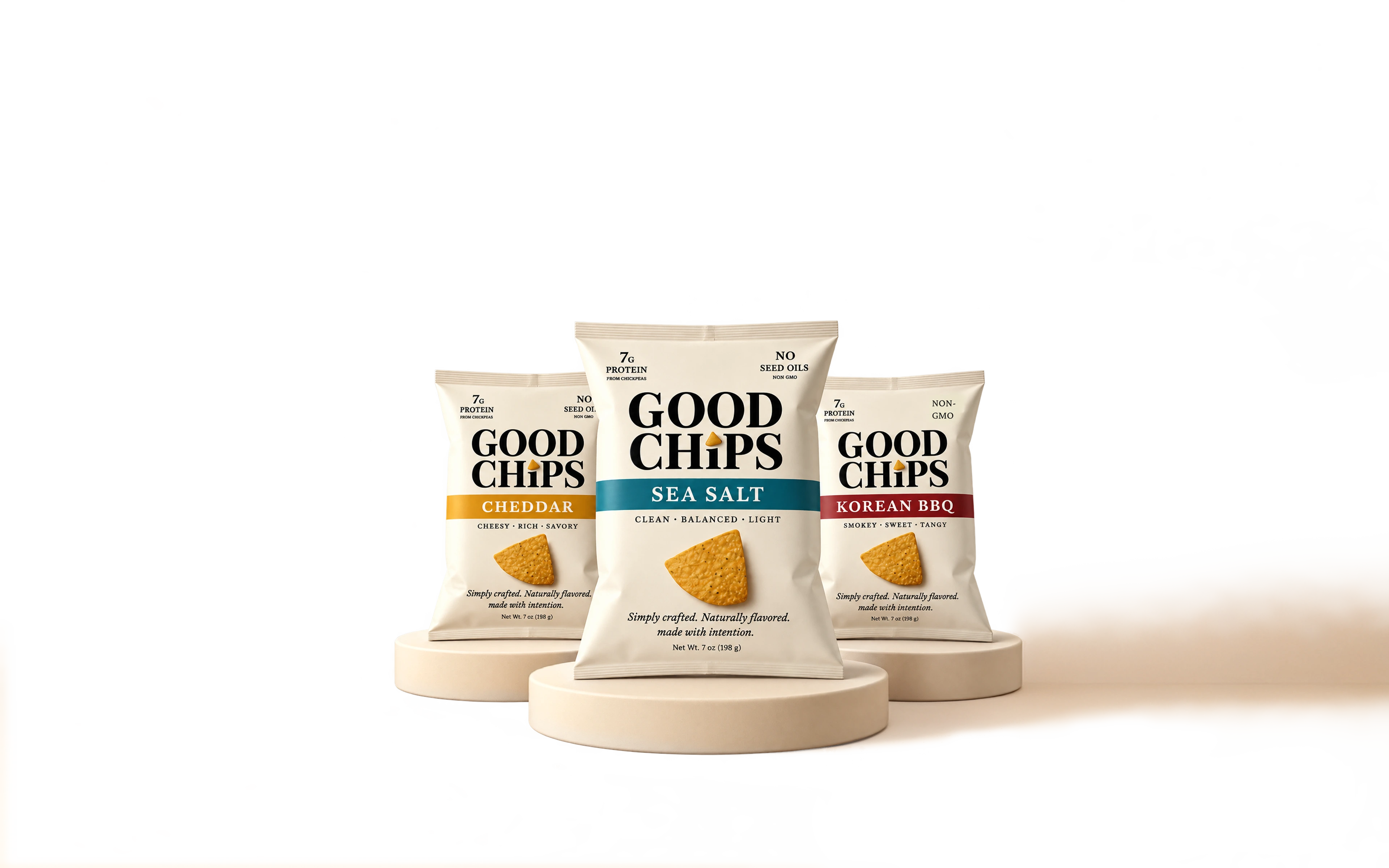 Cheddar, Sea Salt and Korean BBQ GOOD CHIPS bags on cream podiums