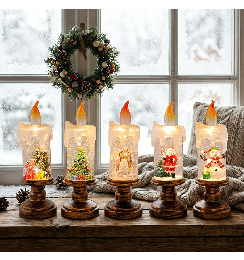 Five Christmas candle lights near a winter window