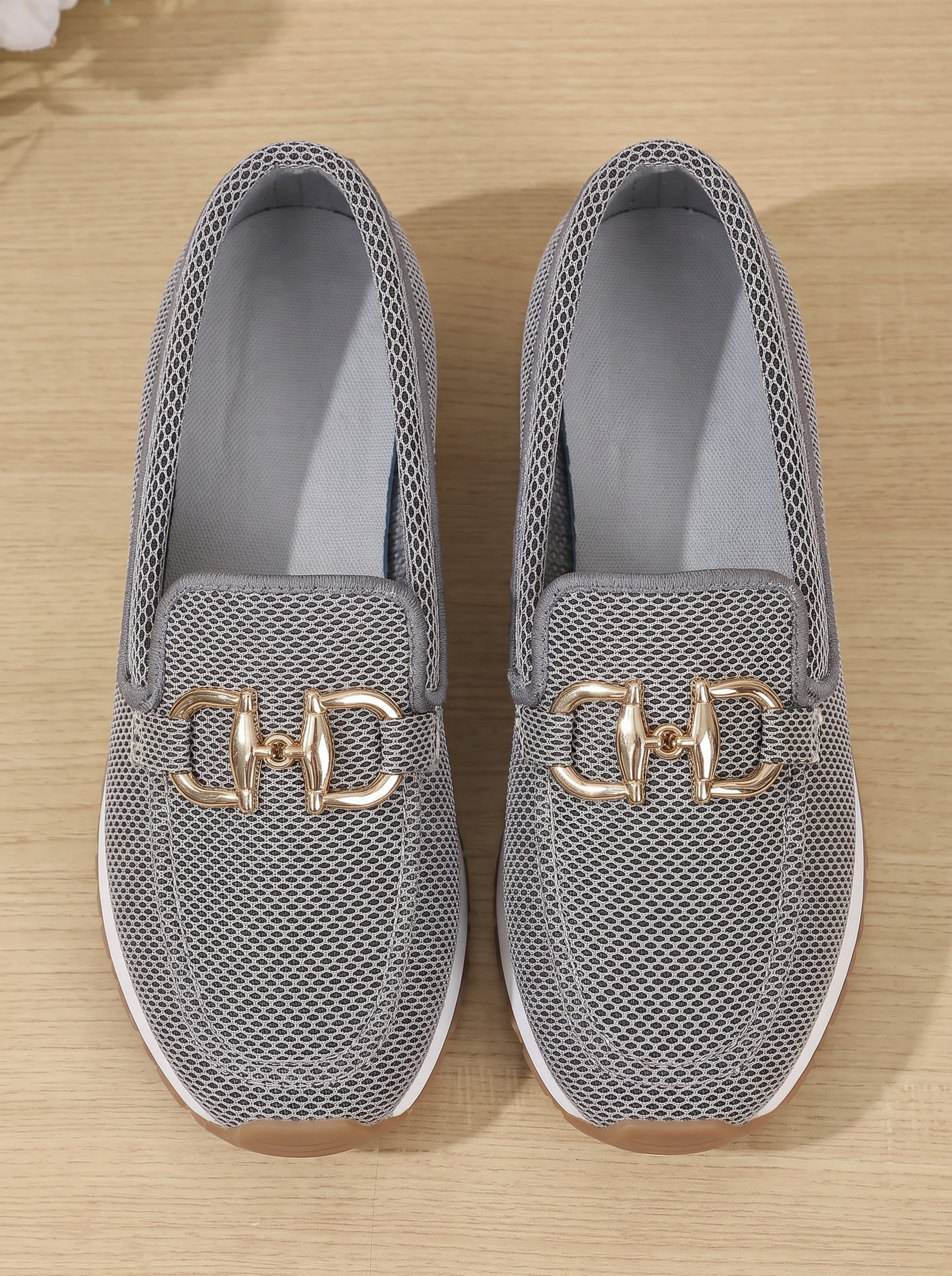 Close-up of silver gray mesh and gold-tone hardware