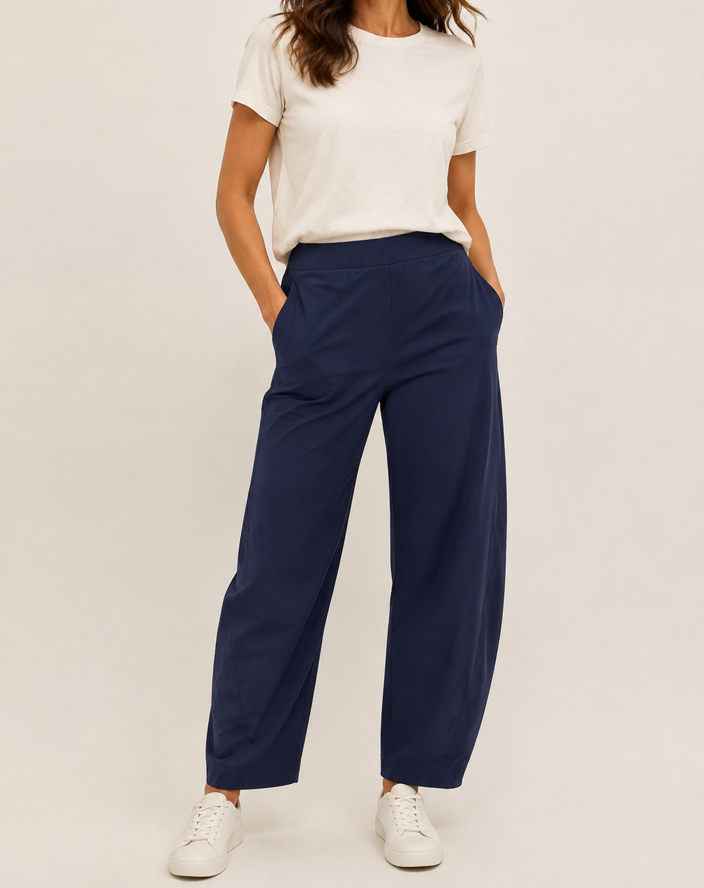 Navy Aria barrel-leg pants on a model