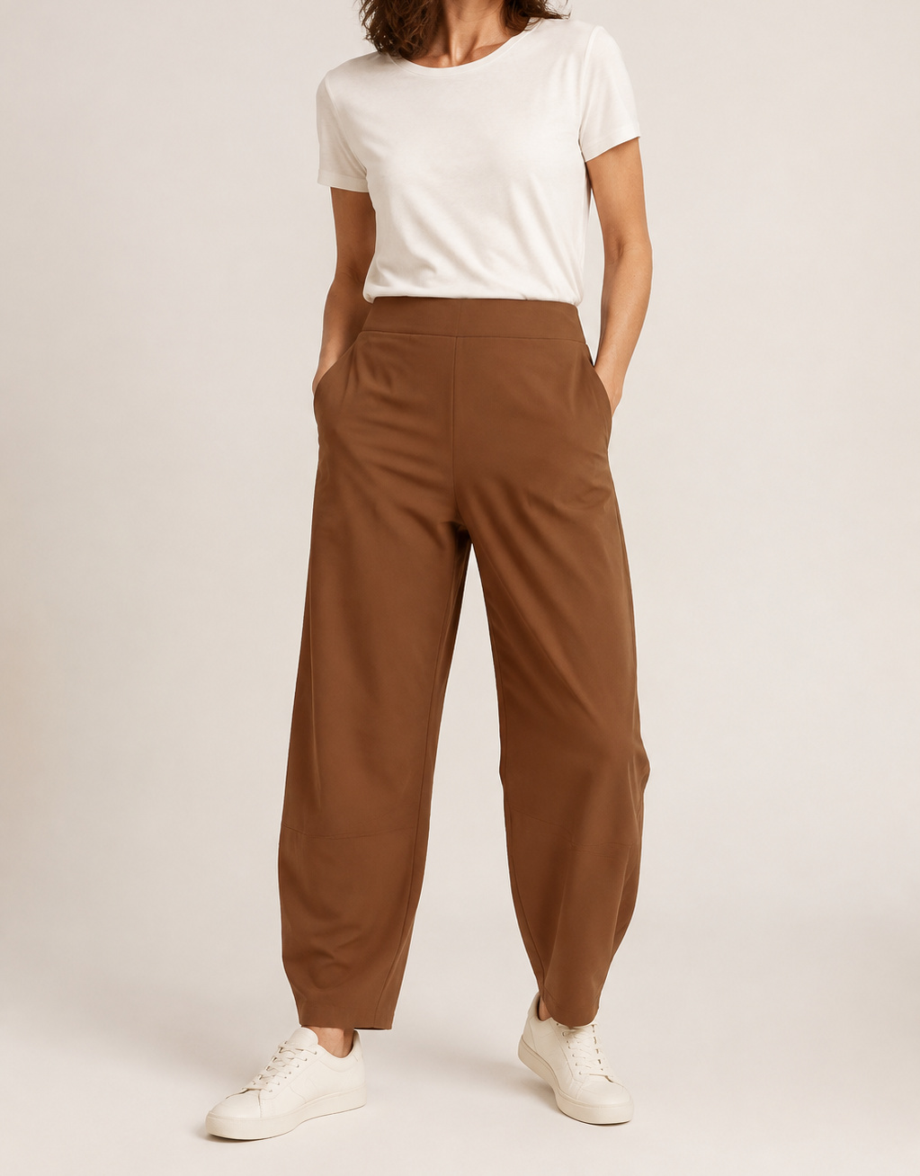 Brown Aria barrel-leg pants on a model