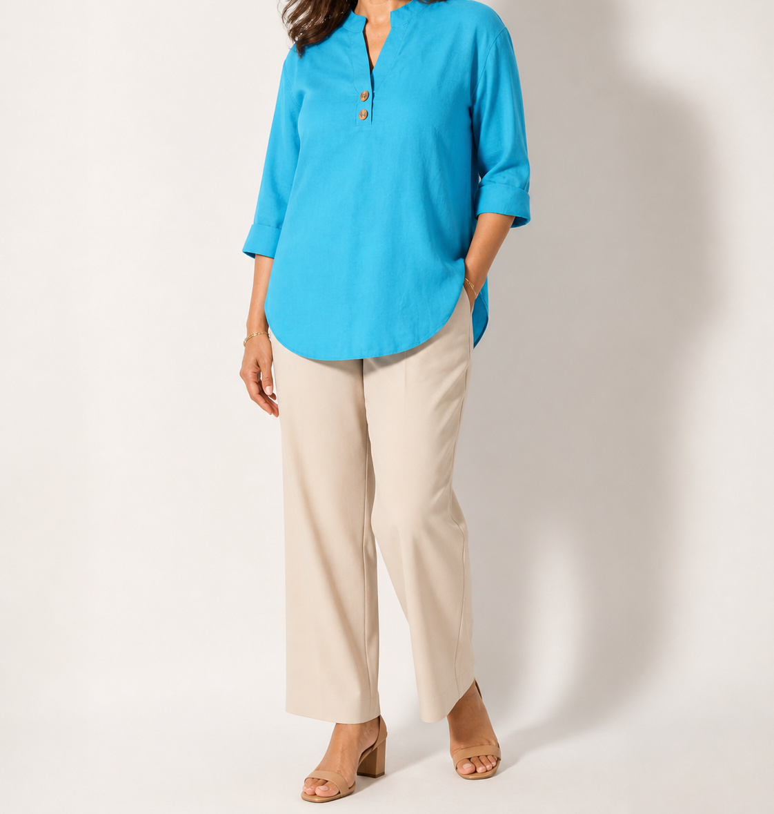 Peacock Blue Elara stretch slub linen-blend tunic blouse on an American model