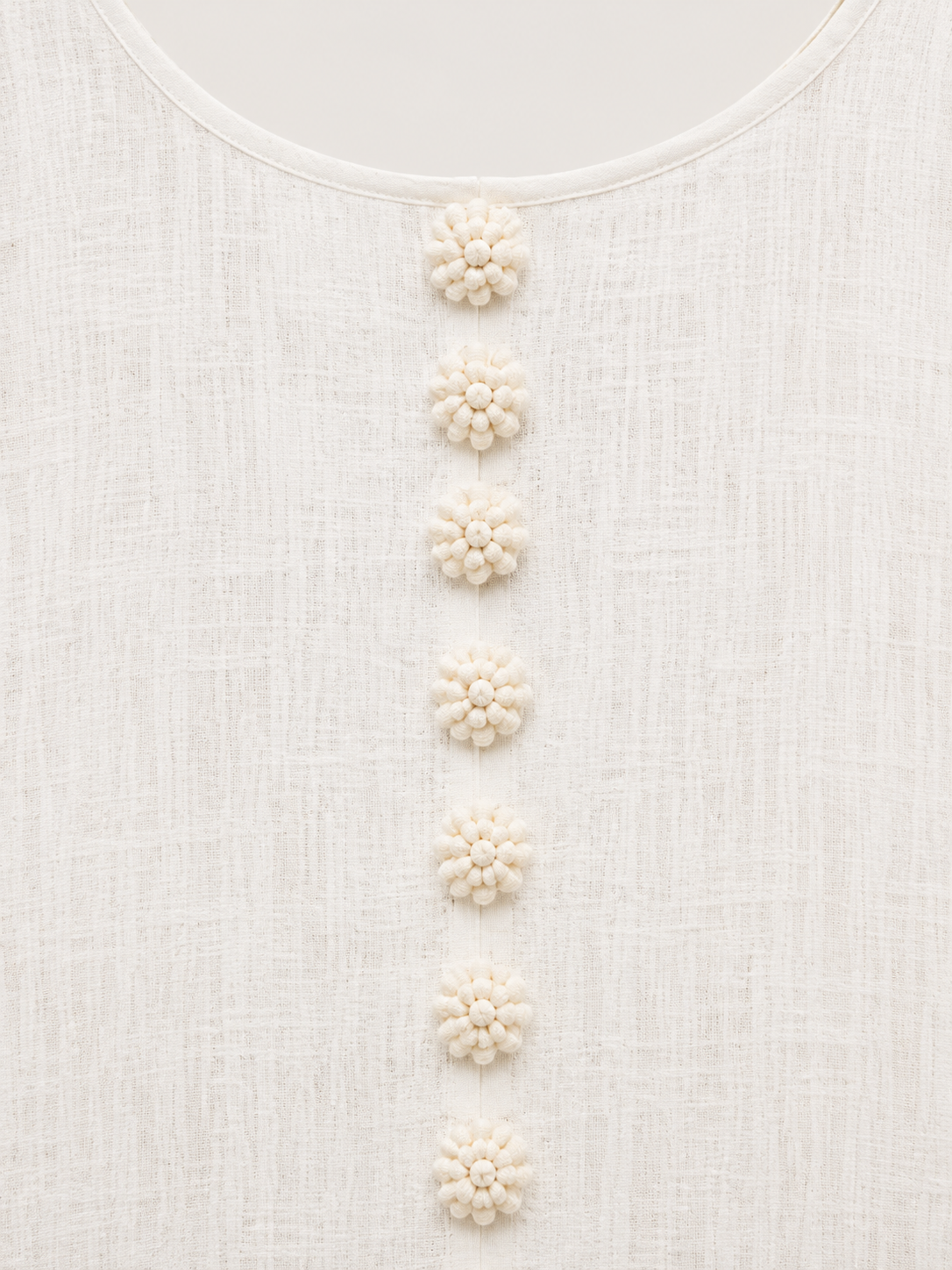 Aurelia round neckline and floral button detail