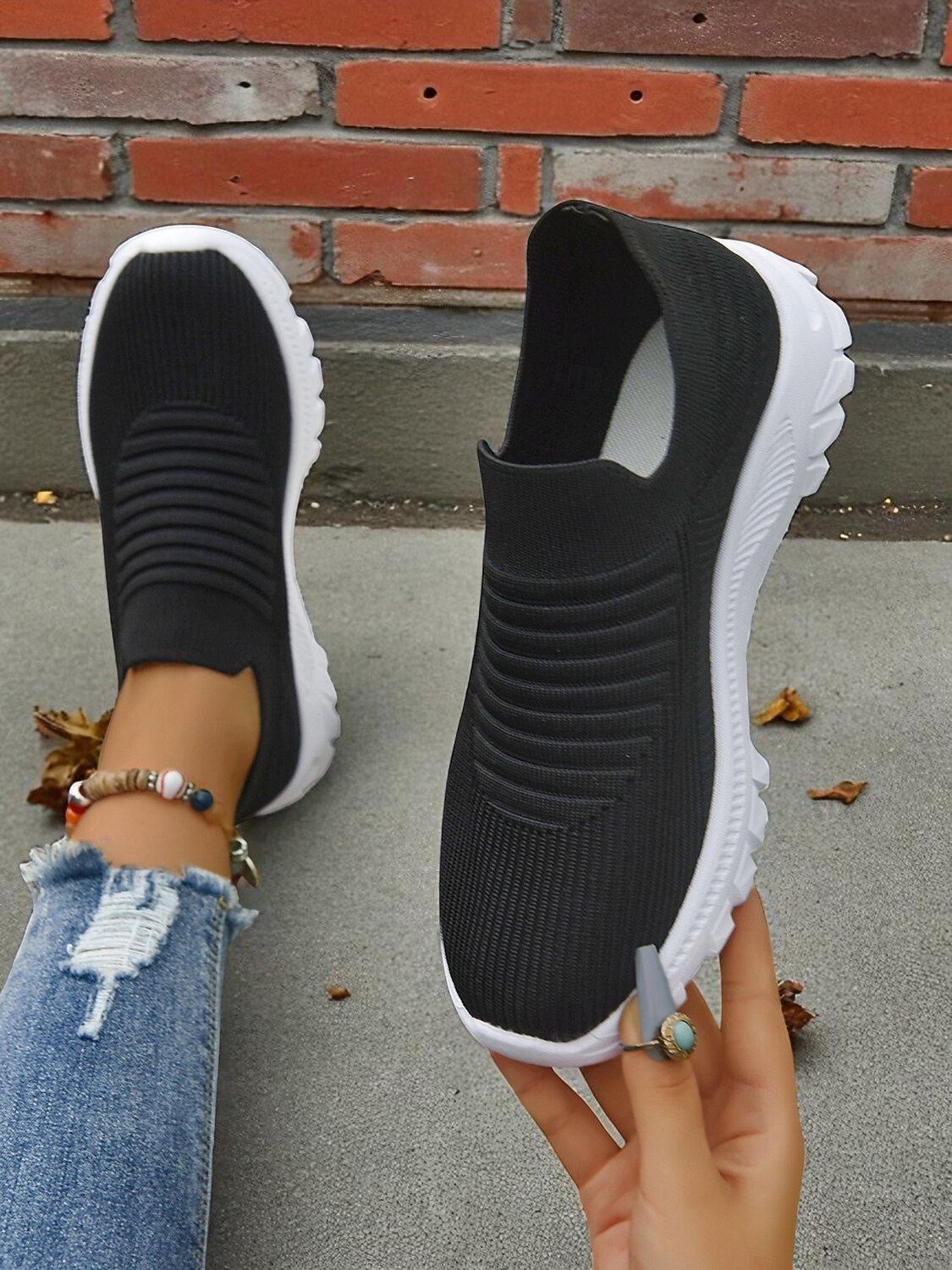 Women's Lightweight Knit Slip-On Walking Sneakers — Black knit slip-ons from above