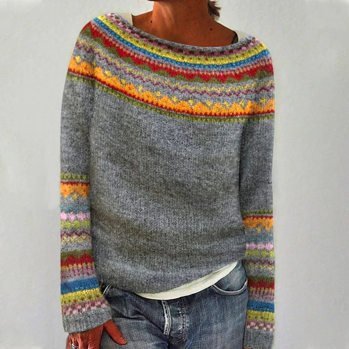 Women's gray knit sweater with a colorful Fair Isle yoke