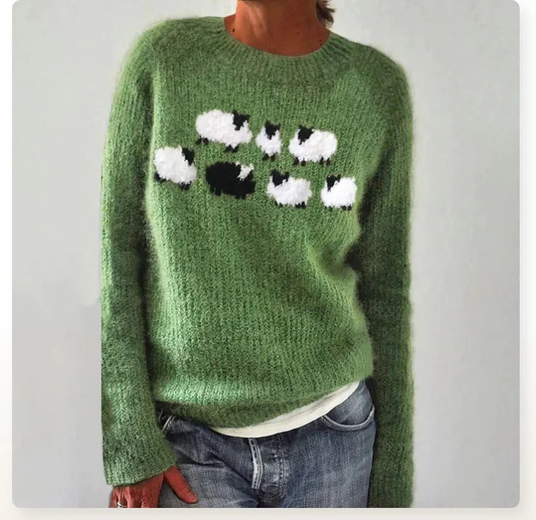 Women's green knit sweater with a raised sheep design