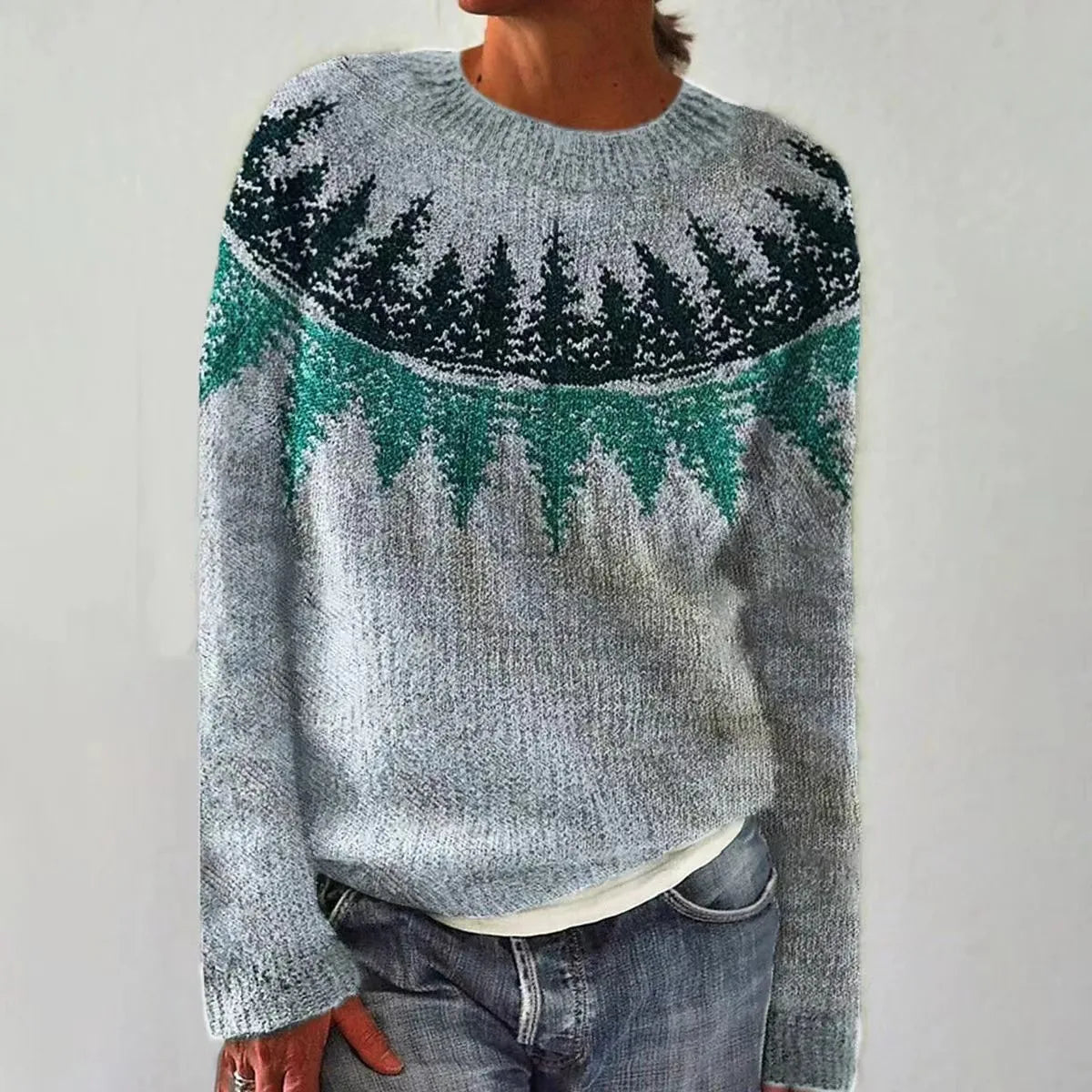 Women's gray knit sweater with an evergreen forest pattern