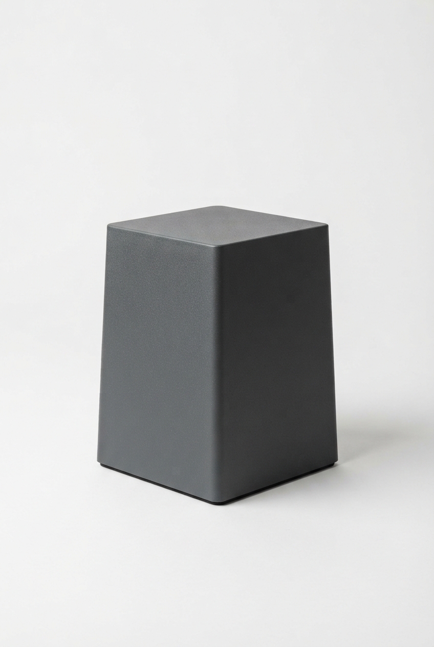 Dark gray furniture riser block with soft pads