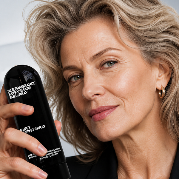 Mature model holding volumizing hair spray