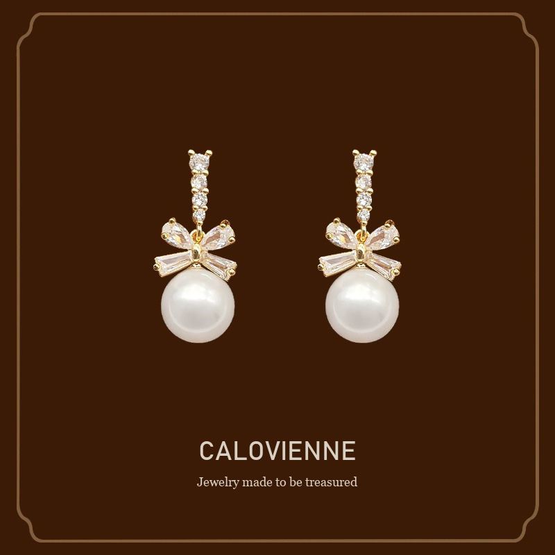 Noelle Bow Butterfly Pearl Clip-On Drop Earrings Calovienne cover image