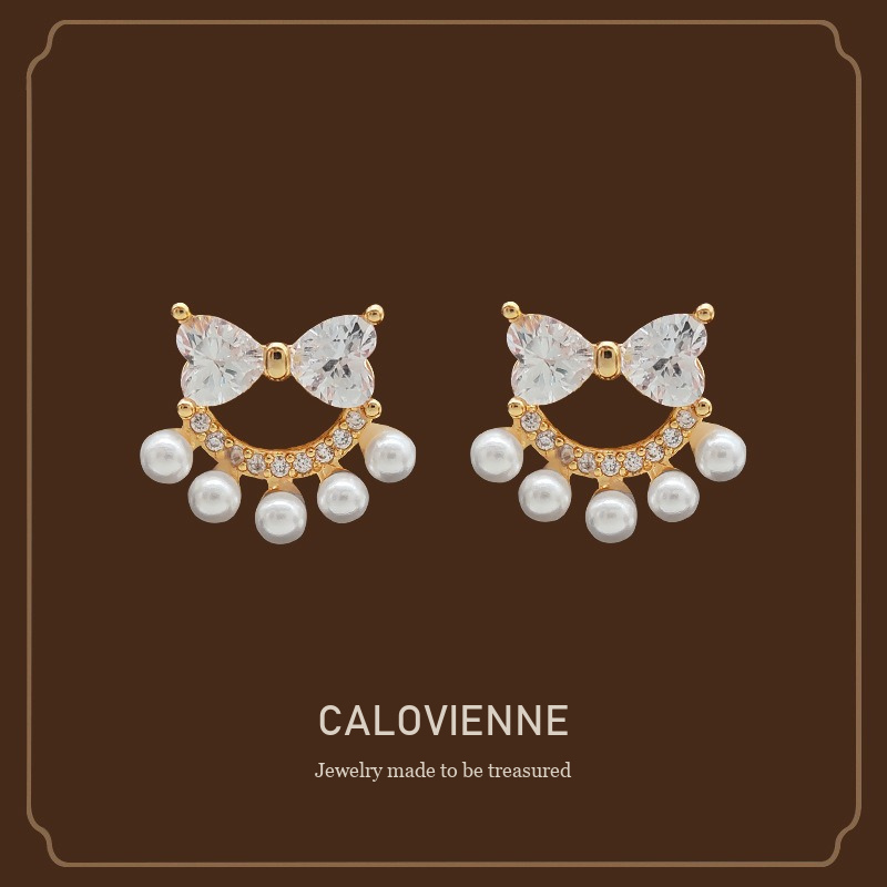 Lumière Bow Butterfly Pearl Clip-On Earrings — Edition 74 Calovienne cover image