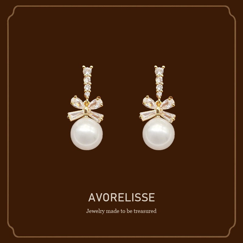 Noelle Bow Butterfly Pearl Clip-On Drop Earrings Avorelisse cover image