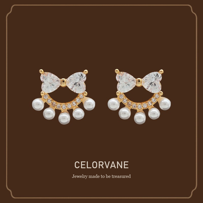 Lumière Bow Butterfly Pearl Clip-On Earrings — Edition 74 Celorvane cover image
