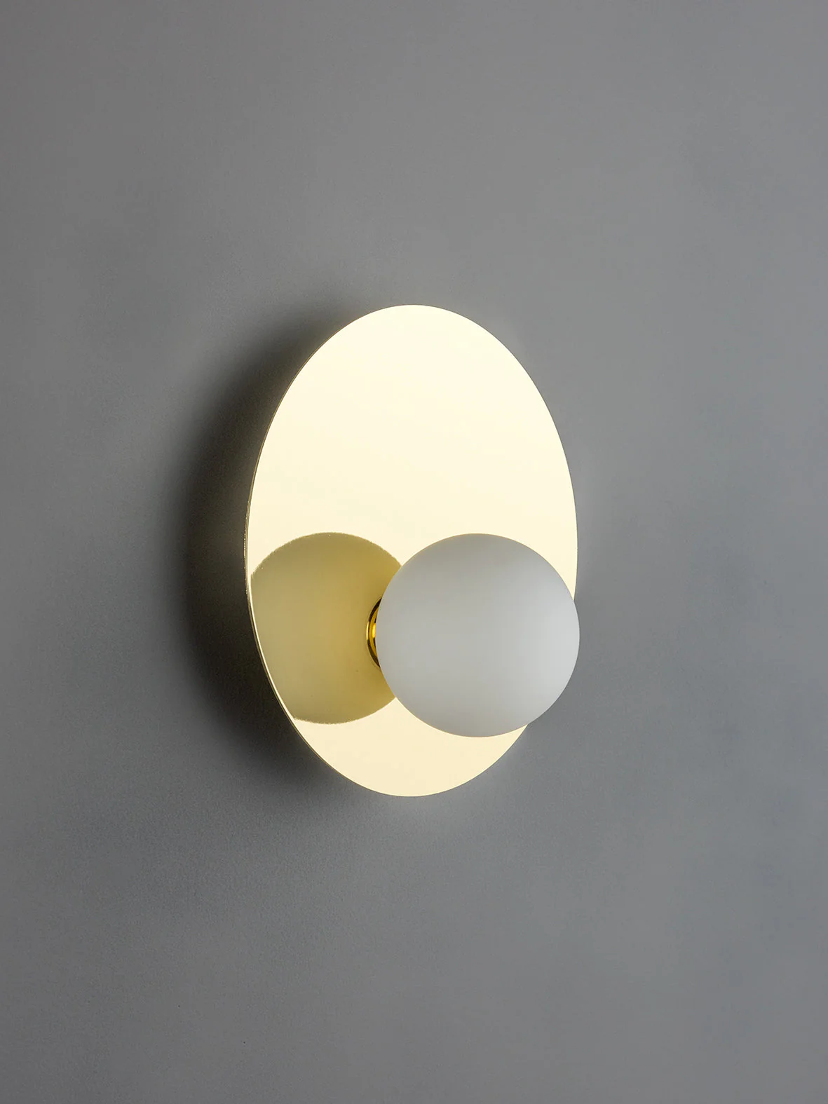 1 light brass and opal wall light