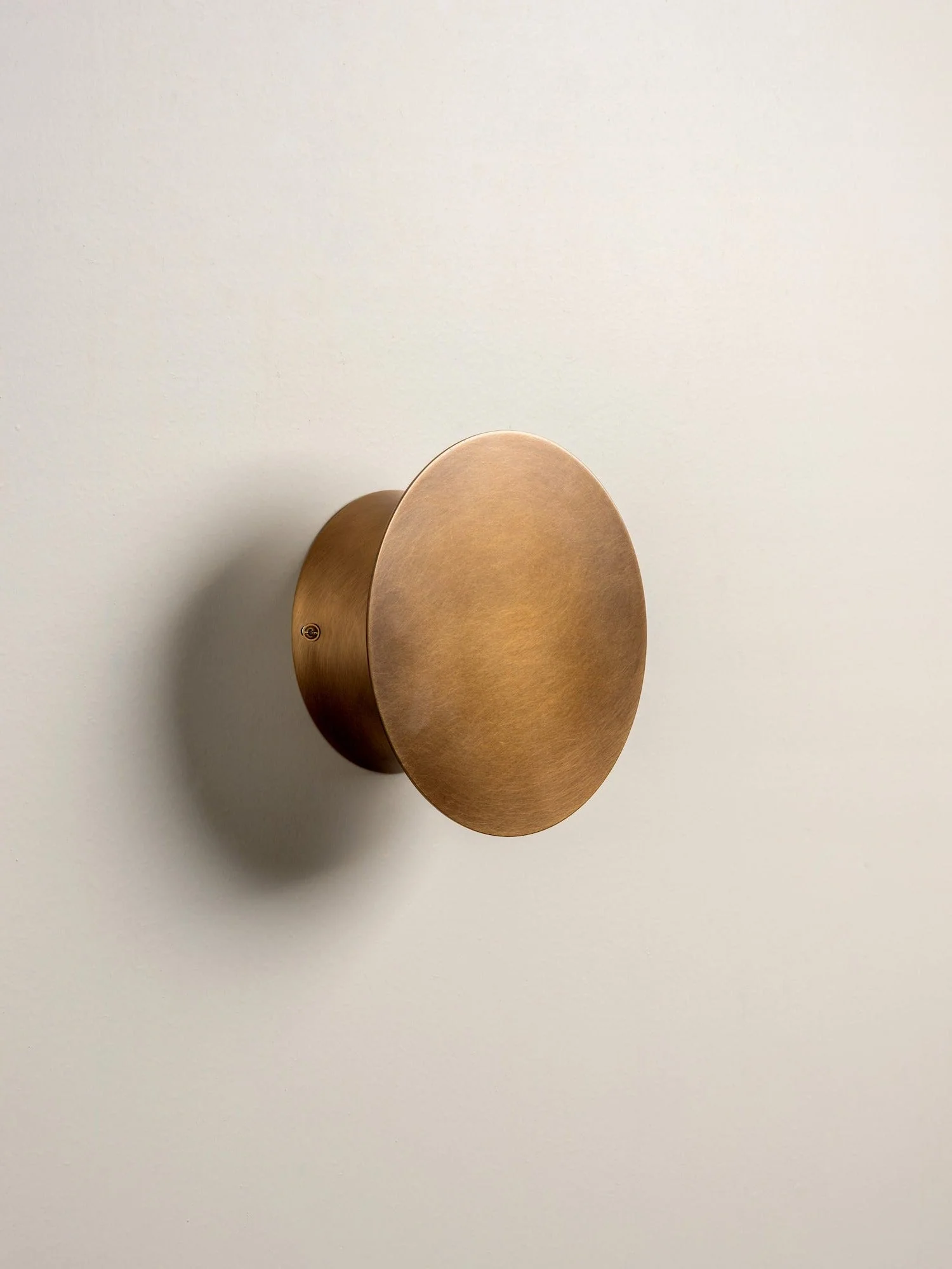 LED adjustable aged brass disc wall light