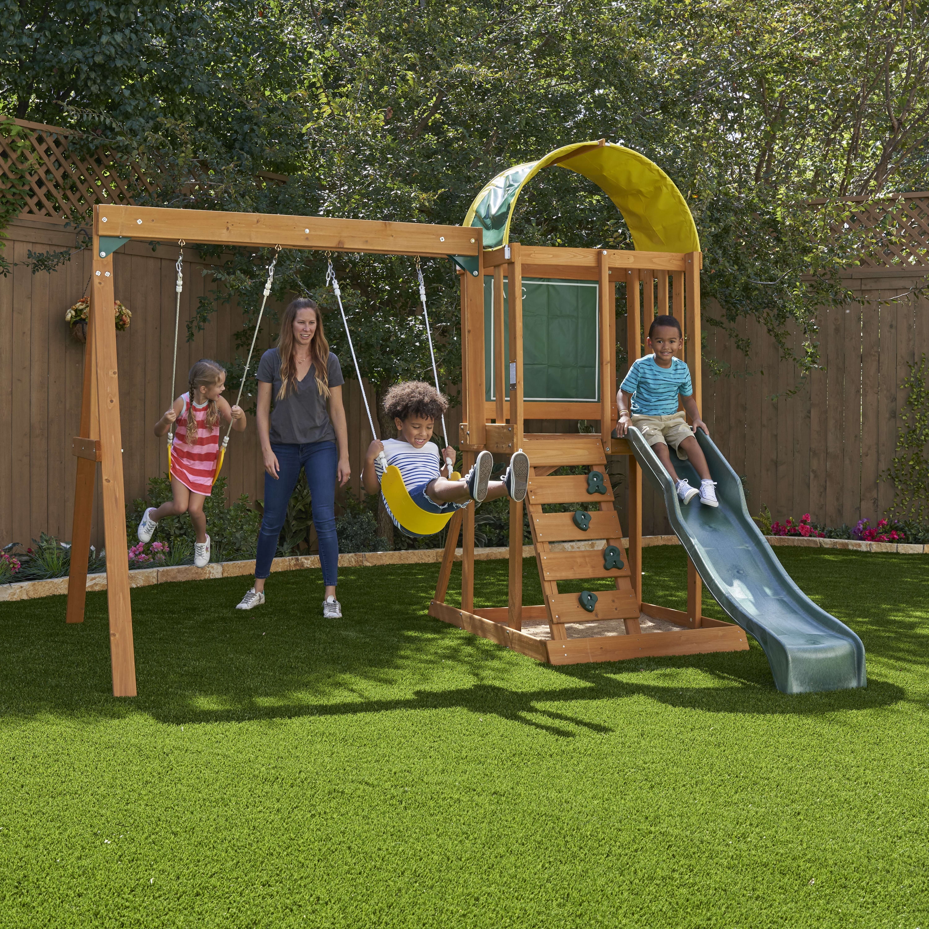 KidKraft Ainsley Wooden Outdoor Swing Set with Slide and Rock Wall - Radiant Selections