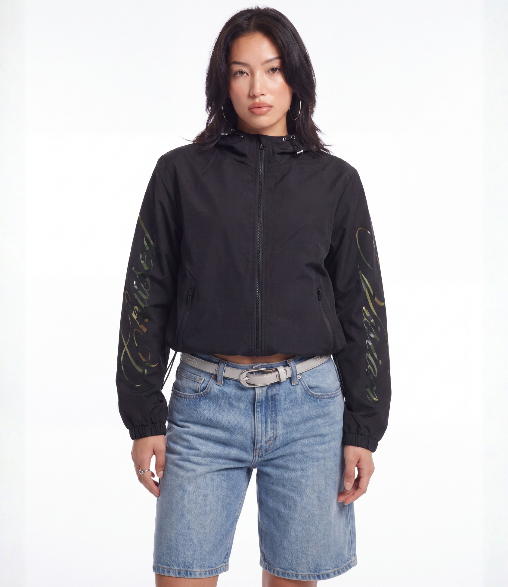 Female model wearing black camo 3-in-1 windbreaker jacket