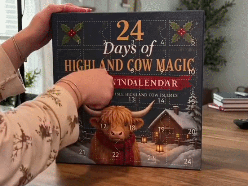 Suggested image: wide hero photo of the Sevinq 24 Days of Highland Cow Advent Calendar with several collectible cow characters displayed beside a decorated Christmas tree