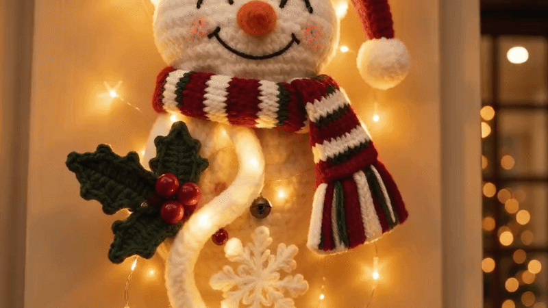 Suggested image: macro close-up of knit-inspired textures, raised flowers, dimensional greenery, berries, ornaments, and dangling holiday details