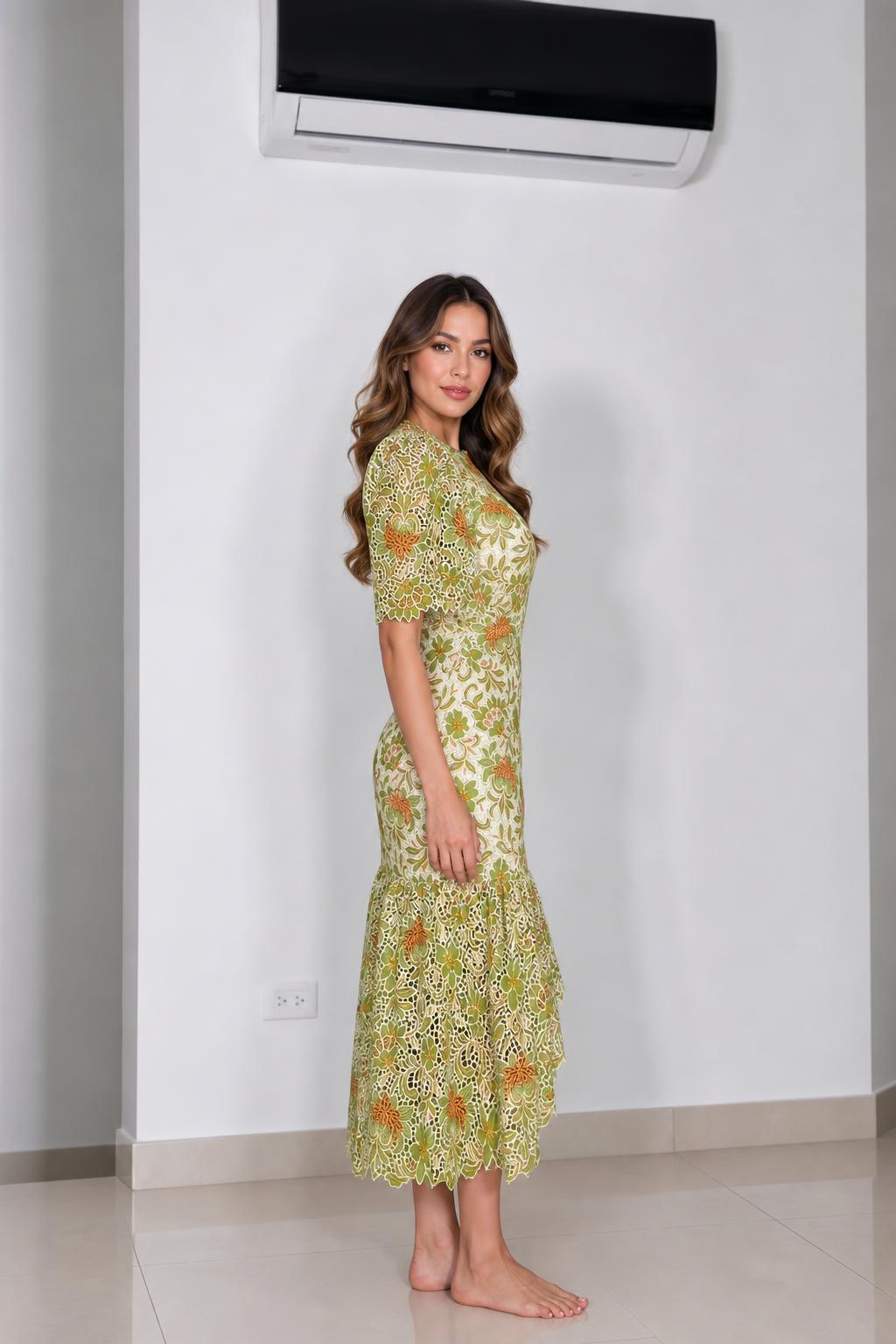 Side profile view of green floral lace midi dress