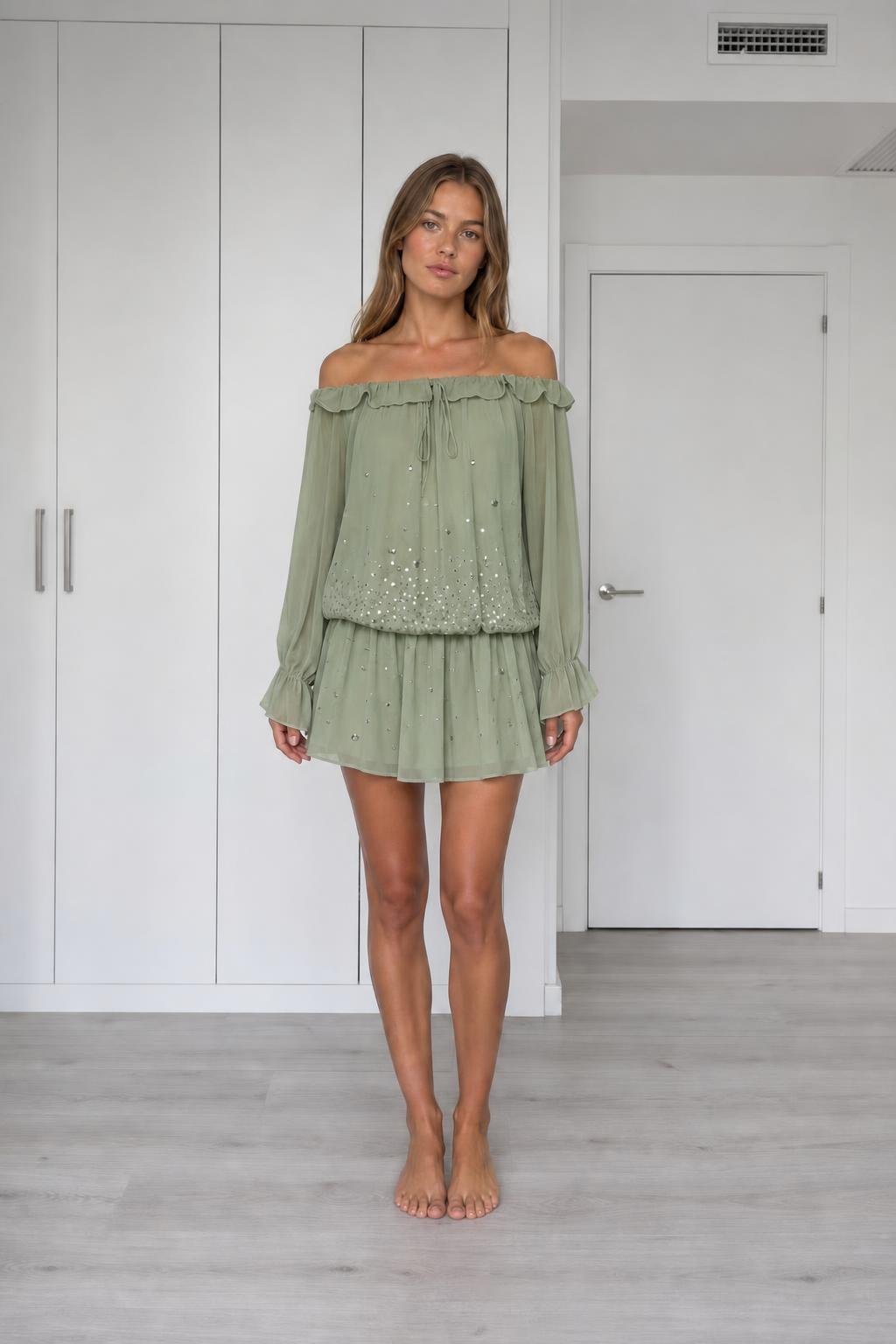 Front view of model wearing sage off-the-shoulder chiffon mini dress