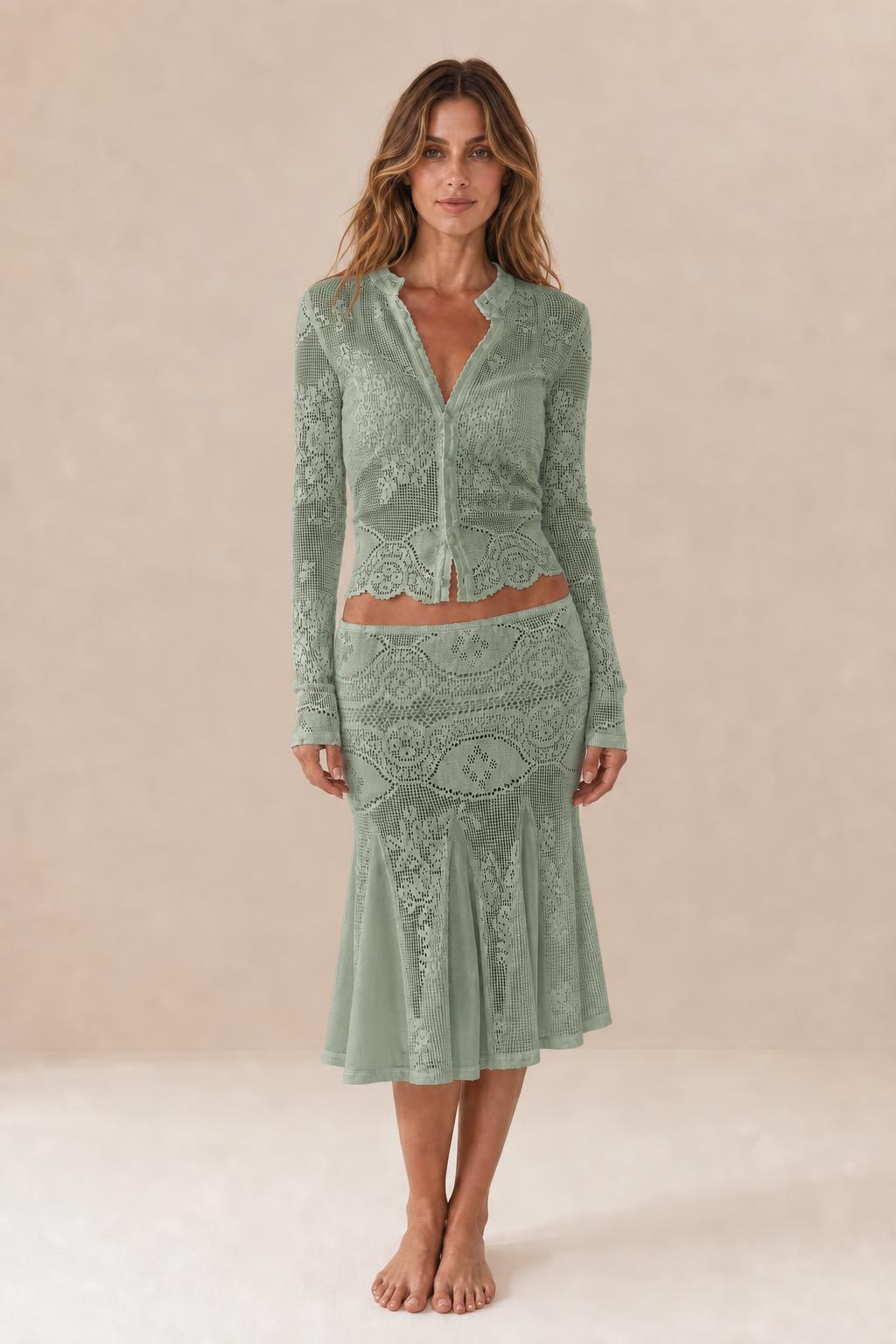 Front view of woman wearing sage green crochet lace two-piece set