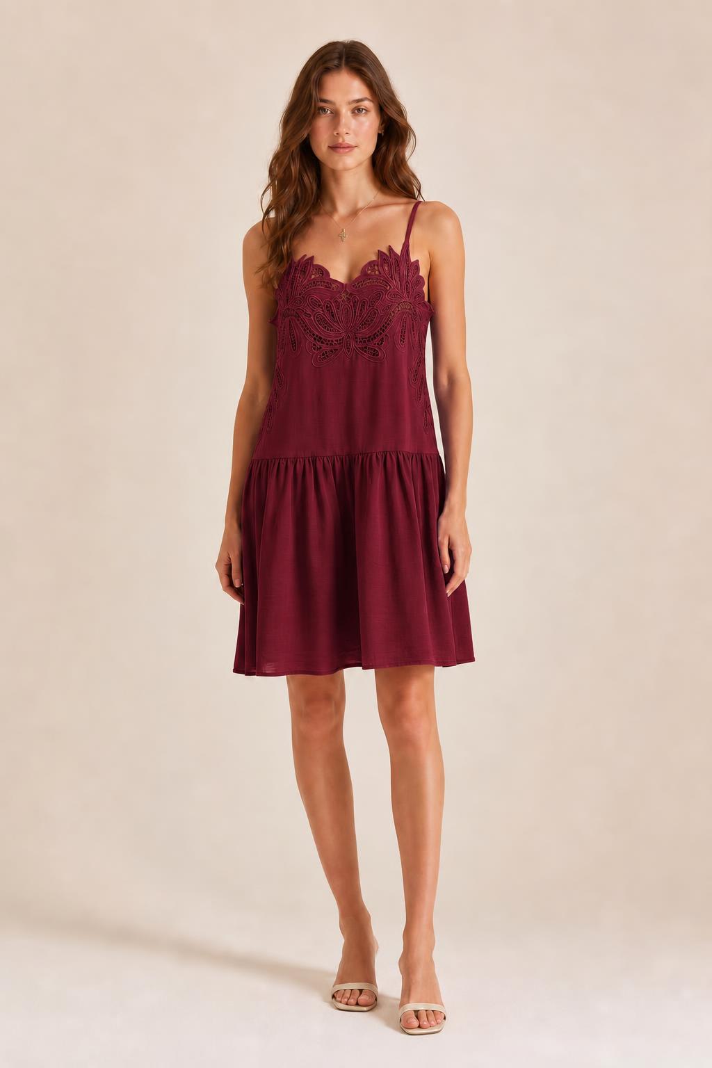 Front view of model in Burgundy embroidered cami mini dress