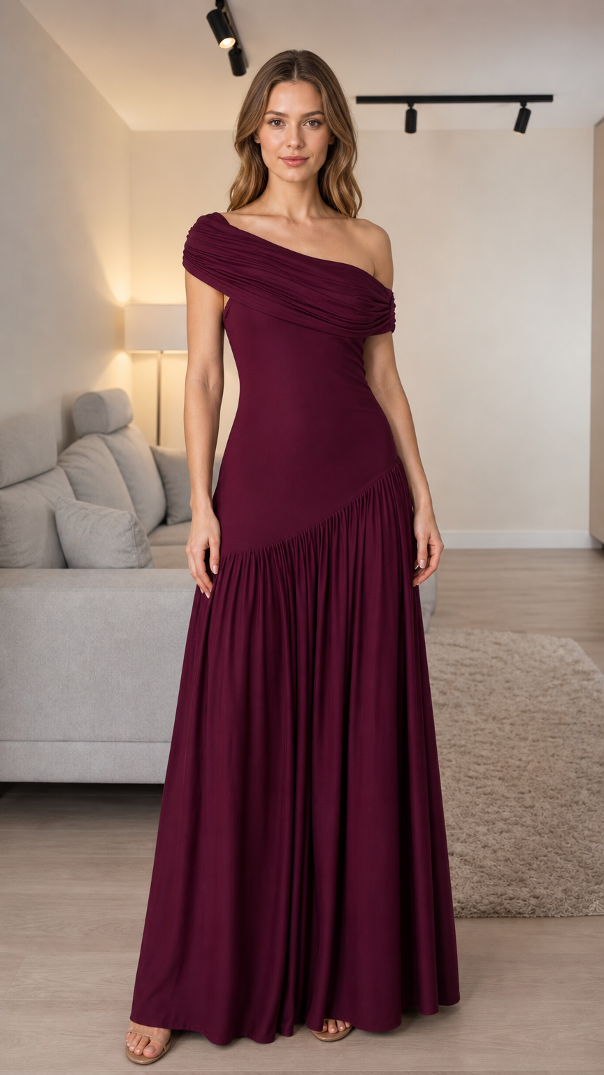 Front view of woman wearing burgundy one-shoulder pleated maxi dress