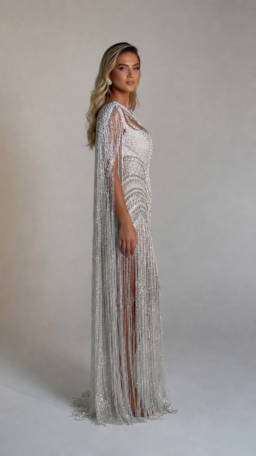 Side profile view of the silver beaded evening gown