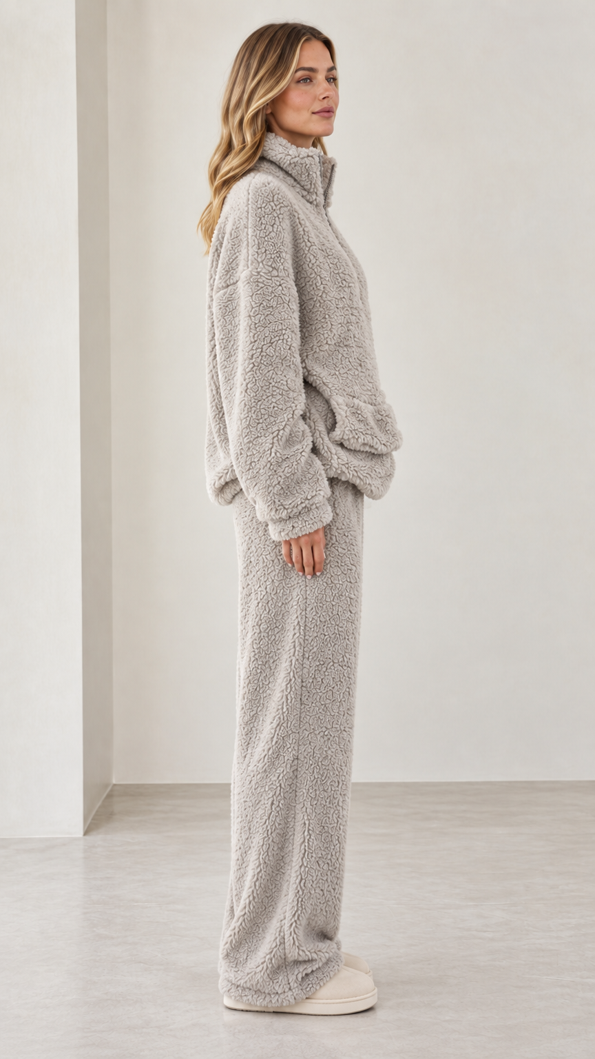 Side profile view of model in light gray teddy fleece matching lounge set