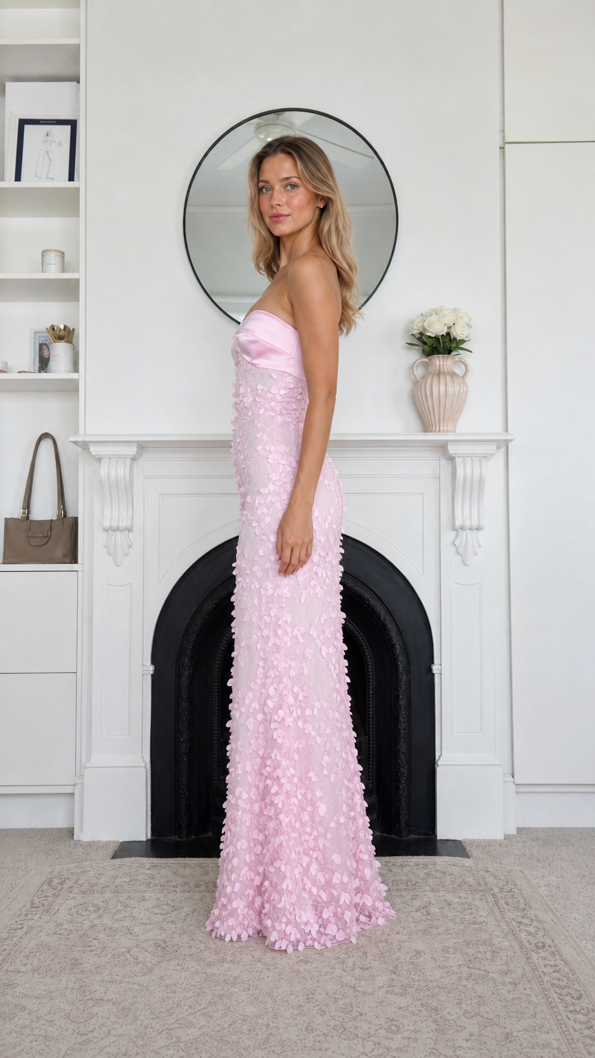 Side profile view of pink strapless maxi dress