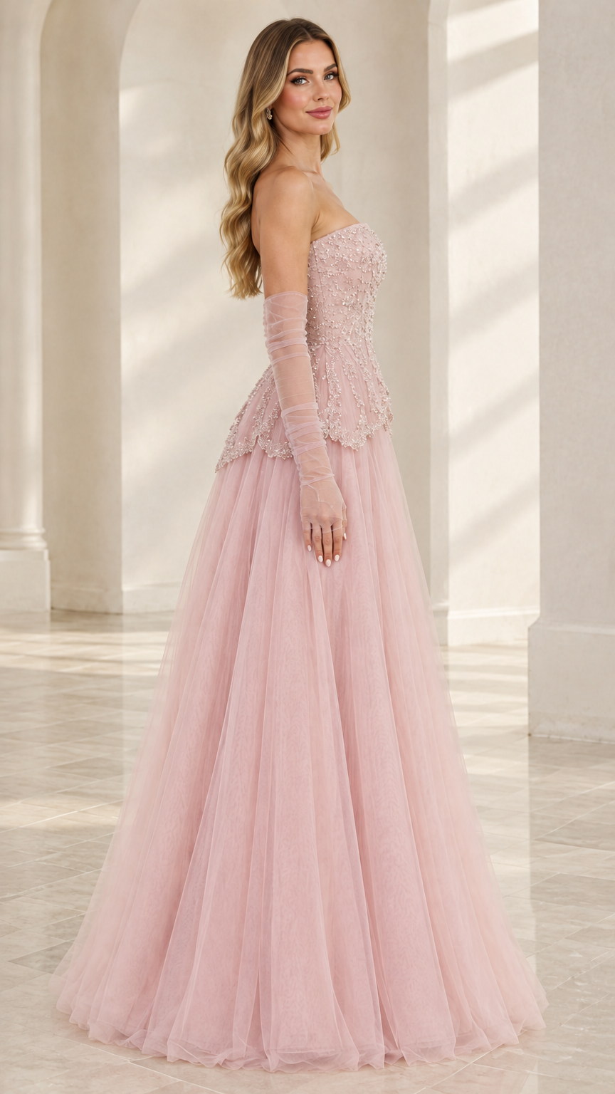 Side view of Blush Pink strapless evening gown showing floor-length tulle skirt