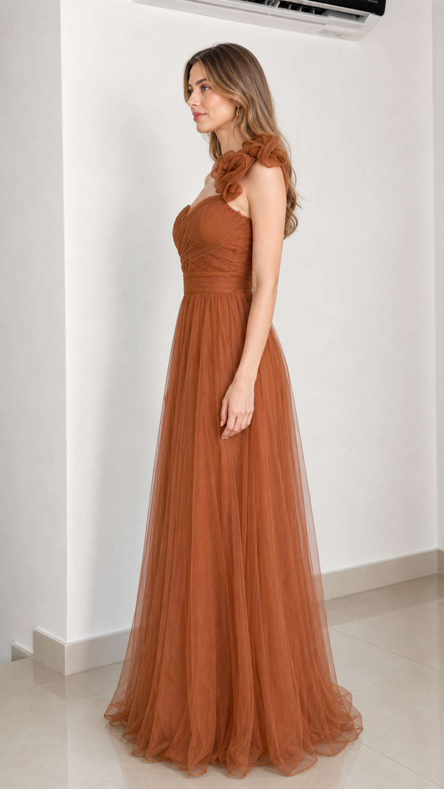 Side profile of rust brown tulle gown