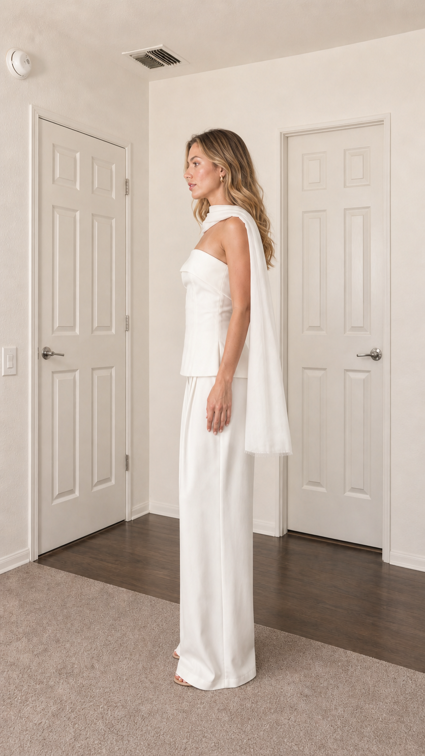Side profile view of model in white two-piece set