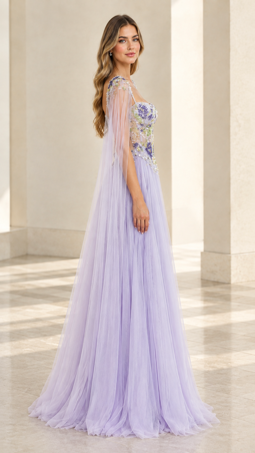 Side profile of lavender tulle A-line formal gown showing cape sleeve drape