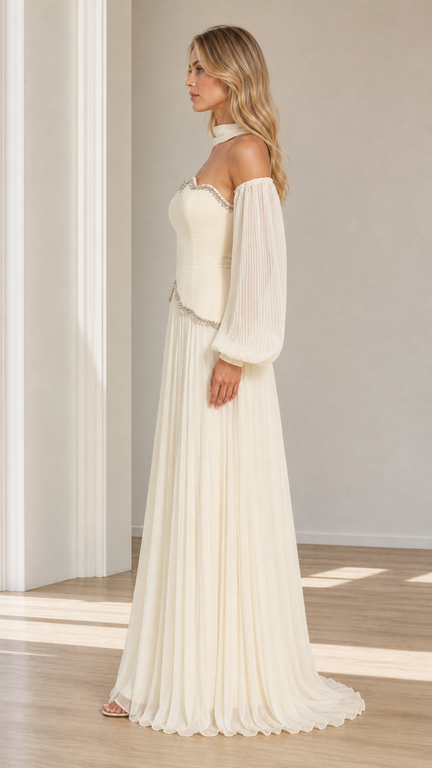 Side profile view of ivory beaded scalloped maxi evening dress with pleated lantern sleeves